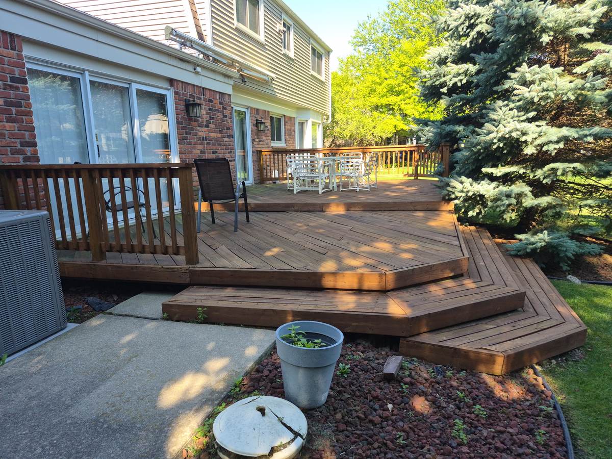 Multi-level backyard deck with patio furniture in Downtown Plymouth, MI