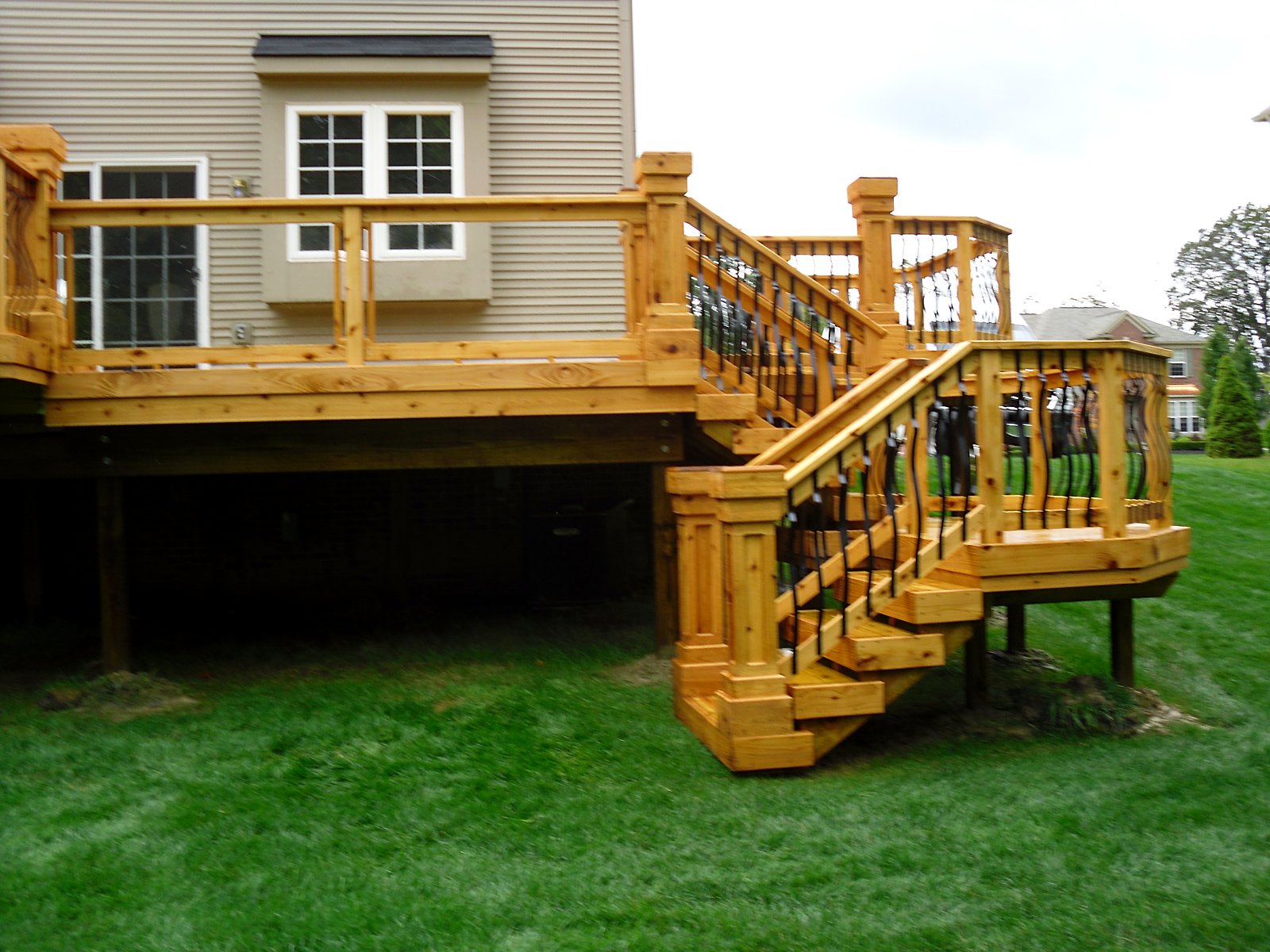 New elevated deck with wrought iron rail in Fenton, MI