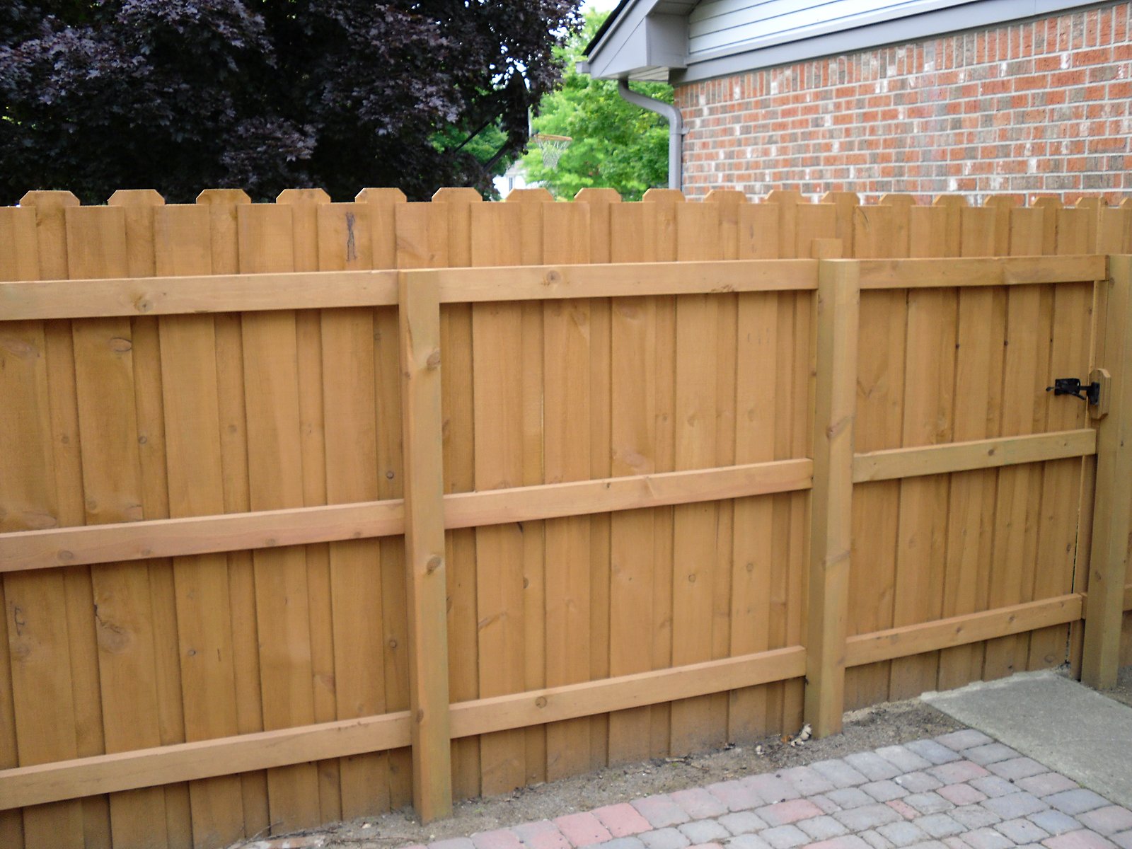 Freshly stained cedar fence in Southeast Michigan