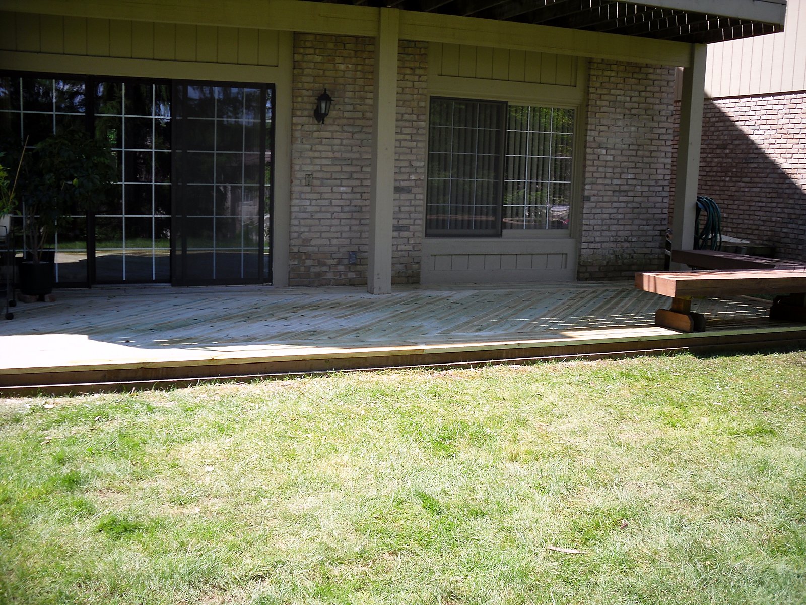 New pressure-treated deck, wide view, same project in Southeast Michigan