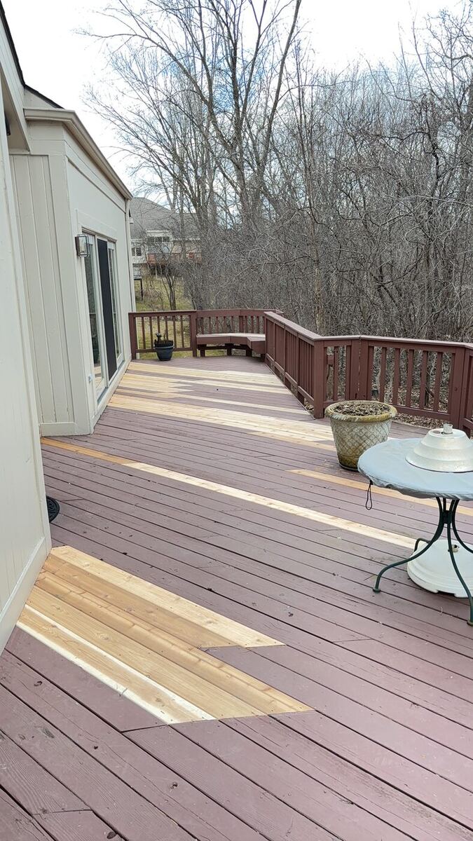 Sections of new unstained cedar decking replacing old weathered decking mid-repair, Novi MI