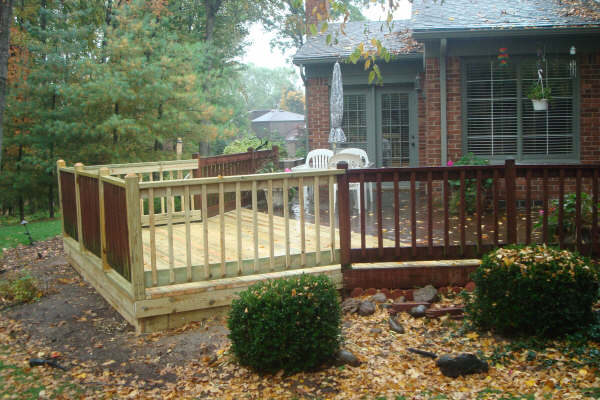New decking and railing being built onto the rebuilt frame, Livonia MI